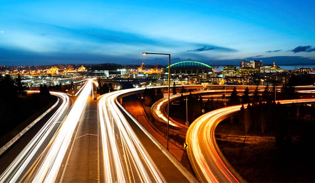 The photo shows a view of the Seattle freeway light trail during the blue hour.